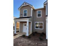 Charming two-story home showcasing a welcoming porch and modern architectural details at 330 Malvern Sw Ave # A, Concord, NC 28025