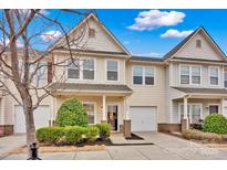 Charming townhome with attached garage, manicured landscaping, and inviting entrance, bathed in natural light at 4708 Tradd Cir, Monroe, NC 28110