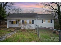 Charming one-story home featuring classic architecture, inviting curb appeal and a well-maintained front yard at 1863 Hilltop Cir, Gastonia, NC 28054