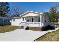 Charming single-story home with a welcoming front porch and well-maintained lawn, perfect for curb appeal at 212 Pursley St, Rock Hill, SC 29732