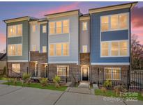 Beautiful new townhomes featuring brick accents, professional landscaping and stylish modern design at 3928 Craig Ave, Charlotte, NC 28211