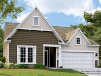 Charming one story home featuring a two-car garage, traditional design, and beautiful landscaping at 5944 Oak Branch Cir, Maiden, NC 28650