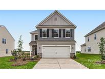 Charming two-story home with a symmetrical design, a two-car garage, and a well-manicured lawn at 6277 Fairfax Ct, Maiden, NC 28650