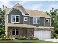 Charming two-story home with a stone facade, complemented by a well-manicured lawn and colorful flowers at 6289 Fairfax Ct, Maiden, NC 28650