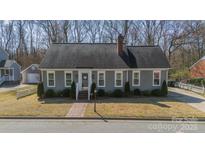 Charming single-story home with a brick walkway, well-kept lawn, and inviting curb appeal at 285 Fryling Sw Ave, Concord, NC 28025