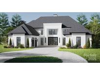 An impressive two-story home featuring a modern design, black window frames, and a well-manicured lawn at 434 Lansdowne Rd, Charlotte, NC 28270