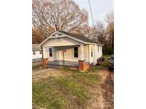 Charming single-story home with a welcoming front porch and well-maintained lawn at 120 3Rd Ave, Conover, NC 28613