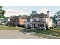 New luxury homes boast beautiful brickwork, covered porches, and professionally landscaped yards at 4008 Nettie Ct # 3, Charlotte, NC 28211