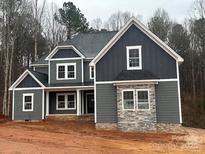 Newly constructed two-story home featuring gray siding, white trim, and stone accents on the facade at 7221 Static Way # 13, Sherrills Ford, NC 28673