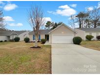 Charming single-story home with a well-maintained lawn, complemented by an attached single-car garage and blue shutters at 7926 Sir Barton Ct, Charlotte, NC 28215