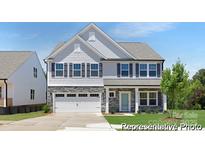Charming two-story home with stone accents, a two-car garage, and landscaped front yard at 109 Stonewater Dr # 26, Red Cross, NC 28129