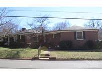 Charming brick home featuring a well-maintained lawn and inviting entrance in a desirable neighborhood at 121 Quincy Dr # 1, Belmont, NC 28012