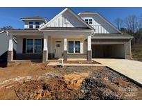 Charming new construction home with a covered front porch and attached two car garage at 237 Miramar Dr, York, SC 29745