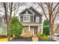 Charming two-story home with a welcoming front porch and well-maintained landscaping at 11329 Charlotte View Dr, Charlotte, NC 28277