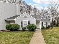 Charming home featuring a well-maintained lawn, sidewalk, and beautiful landscaping at 1544 Hunt Club Ct, Rock Hill, SC 29732