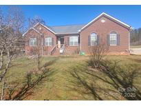 Charming single-story brick home with a well-manicured lawn and inviting front entrance at 1638 Bess Town Rd, Bessemer City, NC 28016