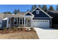 Charming new construction home featuring a two-car garage and inviting covered front porch at 2036 Skyhawk Dr, York, SC 29745