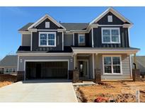 New construction home with a two-car garage and a mix of gray and dark-gray siding at 2211 Camber Dr # Cwo0103, Gastonia, NC 28054