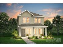 Charming two-story home featuring neutral siding, a covered entry, and neatly landscaped front yard at 13033 Garren View Ln # 313, Charlotte, NC 28278