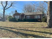 Charming brick home with a well-maintained front yard and mature trees at 708 Mount Olive Church Rd, Newton, NC 28658