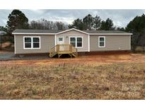 Charming single-story home with neutral siding, complemented by a small porch and classic windows at 238 Fairchase Cir # 54, Stony Point, NC 28678