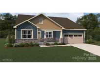 Charming craftsman-style home with stone accents, blue siding, covered porch, and a two-car garage at 2513 Crimson Way, Monroe, NC 28112