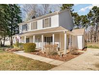 Charming two-story home with a covered front porch and meticulously maintained landscaping at 2542 Clearkirk Ct, Matthews, NC 28105