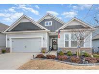 Charming single Gathering home with a 2 car garage and manicured lawn in desirable neighborhood at 4023 Gozzi Dr, Iron Station, NC 28080