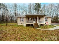 Charming single-story home featuring a welcoming front porch, perfect for relaxing outdoors at 68 37Th Nw St, Hickory, NC 28601