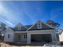 New construction home with a two-car garage and gray siding on a sunny day at 0 6Th Nw St, Hickory, NC 28601