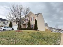Two story home with beige siding, red shutters, and a well-maintained front yard at 14809 Castletown House Dr, Charlotte, NC 28273
