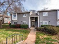Charming condo exterior with well-maintained landscaping and inviting entrance, perfect for comfortable living at 2900 Heathstead Pl # A, Charlotte, NC 28210
