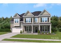 Beautiful two-story home featuring stone accents, black shutters, and a covered front porch at 304 Balboa St, Matthews, NC 28104