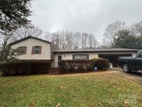 Exterior shot of a one-story house with an open garage and truck in the driveway at 503 Randa Dr, Statesville, NC 28625