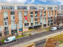 Brick condo building at 710 W Trade St #314 with street view and designated parking at 710 W Trade St # 314, Charlotte, NC 28202