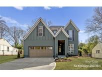 Charming craftsman-style home with a two-car garage, beautiful lawn, and welcoming front entrance at 2019 Mandarin Blvd, Charlotte, NC 28205