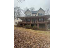 Charming two-story home featuring a spacious front porch perfect for enjoying the outdoors at 369 Falcon Dr, Concord, NC 28025