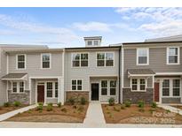 Charming townhome with stone accents and well-maintained landscaping at 4113 Walking Ridge Rd # 56, Charlotte, NC 28208