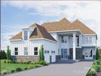 Stunning new construction home featuring stone accents and a three car garage at 4507 Morning Mist Dr # 208, Sherrills Ford, NC 28673