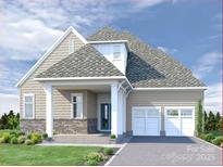 Charming home with a two-car garage, stone accents and inviting covered porch at 4519 Morning Mist Dr # 206, Sherrills Ford, NC 28673