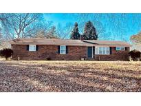 Charming brick ranch-style home featuring classic architectural details and a well-maintained yard at 742 Aquadale Rd, Albemarle, NC 28001