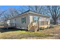 Charming home featuring a welcoming front porch and stylish green shutters, perfect for relaxing outdoors at 756 Separk Cir, Gastonia, NC 28054