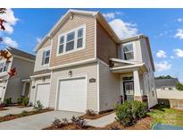 Charming two-story home featuring a two-car garage, neutral siding, and well-manicured landscaping at 2300 Hedgecliff Rd # 160, Kannapolis, NC 28025