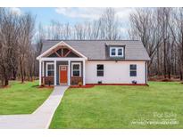 Charming craftsman-style home with a welcoming front porch and well-maintained lawn at 2853 W Zion Church Rd, Shelby, NC 28150