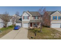 Charming two-story home with a two-car garage and welcoming front porch at 2195 Durand Rd, Fort Mill, SC 29715