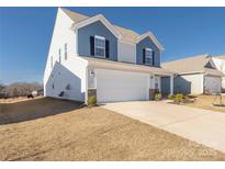 Charming two-story home featuring a two-car garage and blue and white siding at 2754 Legacy Ridge Ln, Catawba, NC 28609