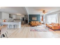 Open-concept living space with a modern kitchen, comfortable seating, and plenty of natural light at 2992 Greenleaf Rd, Clover, SC 29710