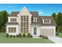 Charming two-story home with large windows, a brick facade, and a well-manicured lawn at 4801 Elder Ave, Charlotte, NC 28205