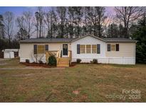 Charming single-story home with manicured lawn and inviting front porch, perfect for relaxing outdoors at 5100 Valleymere Rd, Rock Hill, SC 29732