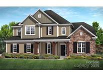 Inviting two-story home with a mix of stone and siding and a covered front porch at 11020 Tyler Brook Ln # Oak0035, Mint Hill, NC 28227